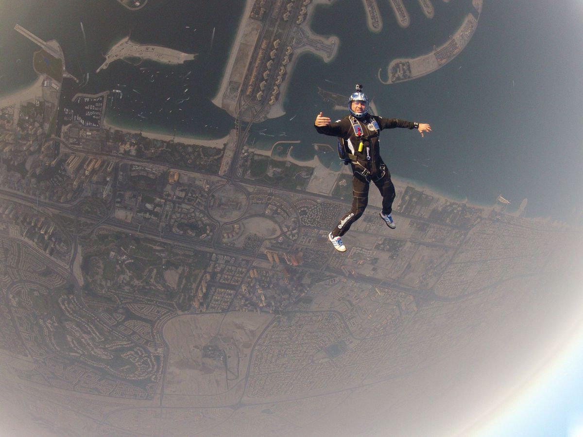 Picture of Yanik Guillemette, skydiving above the iconic Dubai skyline.